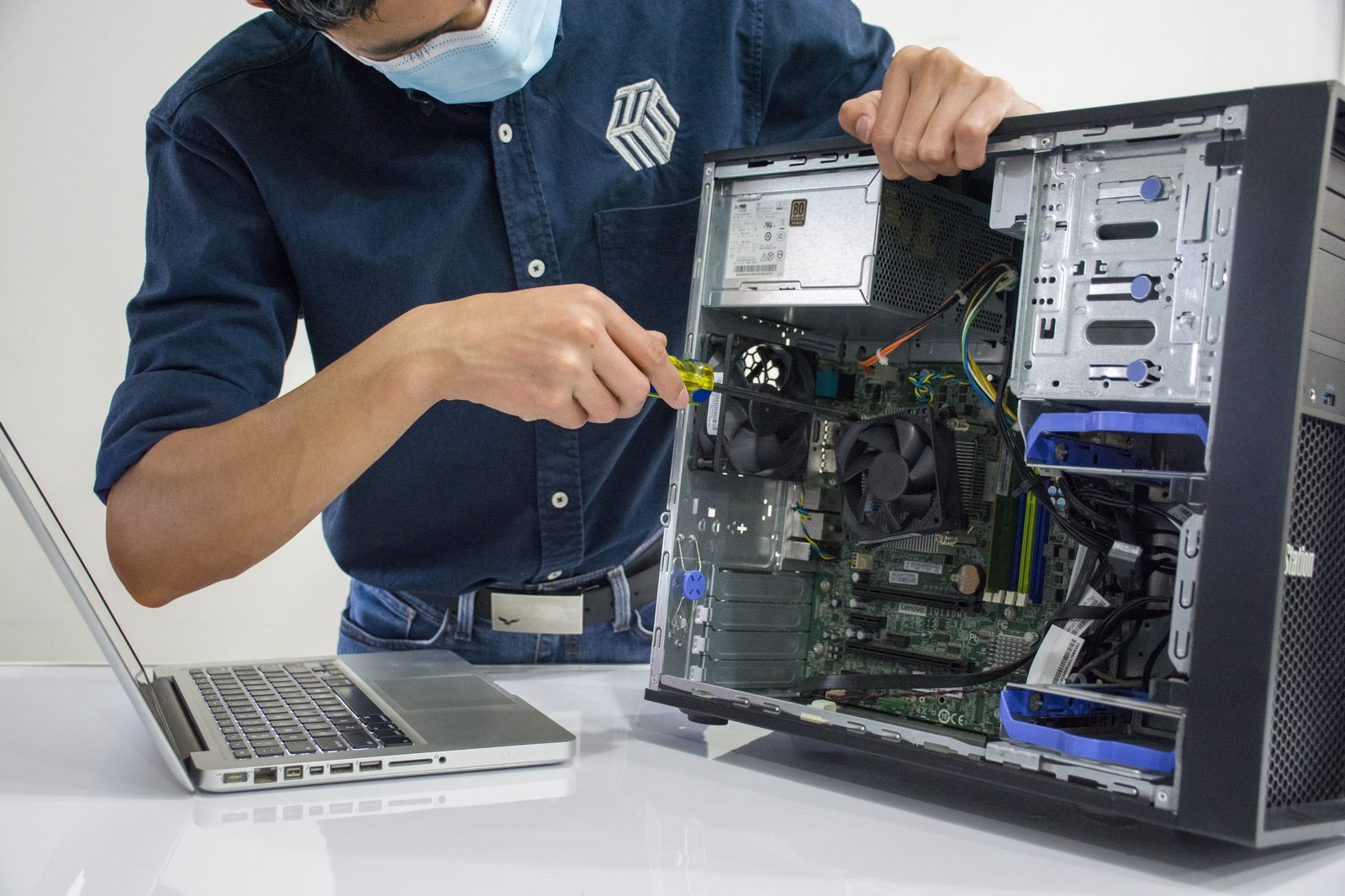 Technician repairing a desktop computer